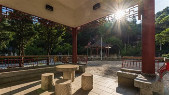 The granite table and chairs harmoniously blend into the garden and providing opportunities for locals to socialise and play chess.